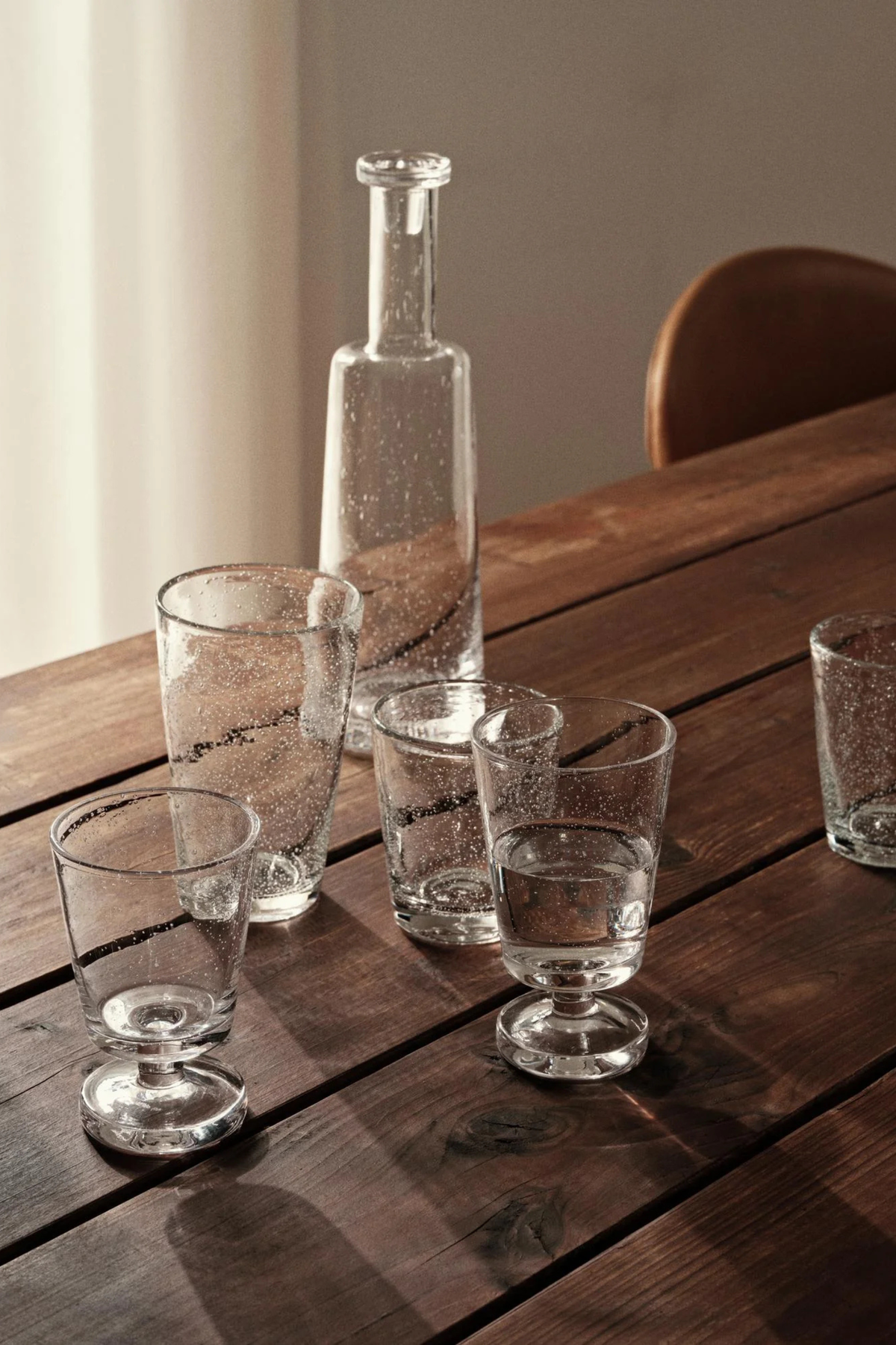 Broste Bubble glasses and carafe on wooden table